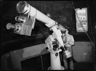 Assistant astronomer Ernest Adderley looking through 6 inch telescope at the Sydney Observatory 18 February 1941