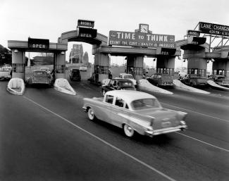 Traffic flowing smoothly on the Sydney Harbour Bridge after two new lanes were opened, July 1959.